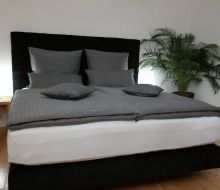 Bett im Zimmer in Pension Franzb&auml;cker in Warburg